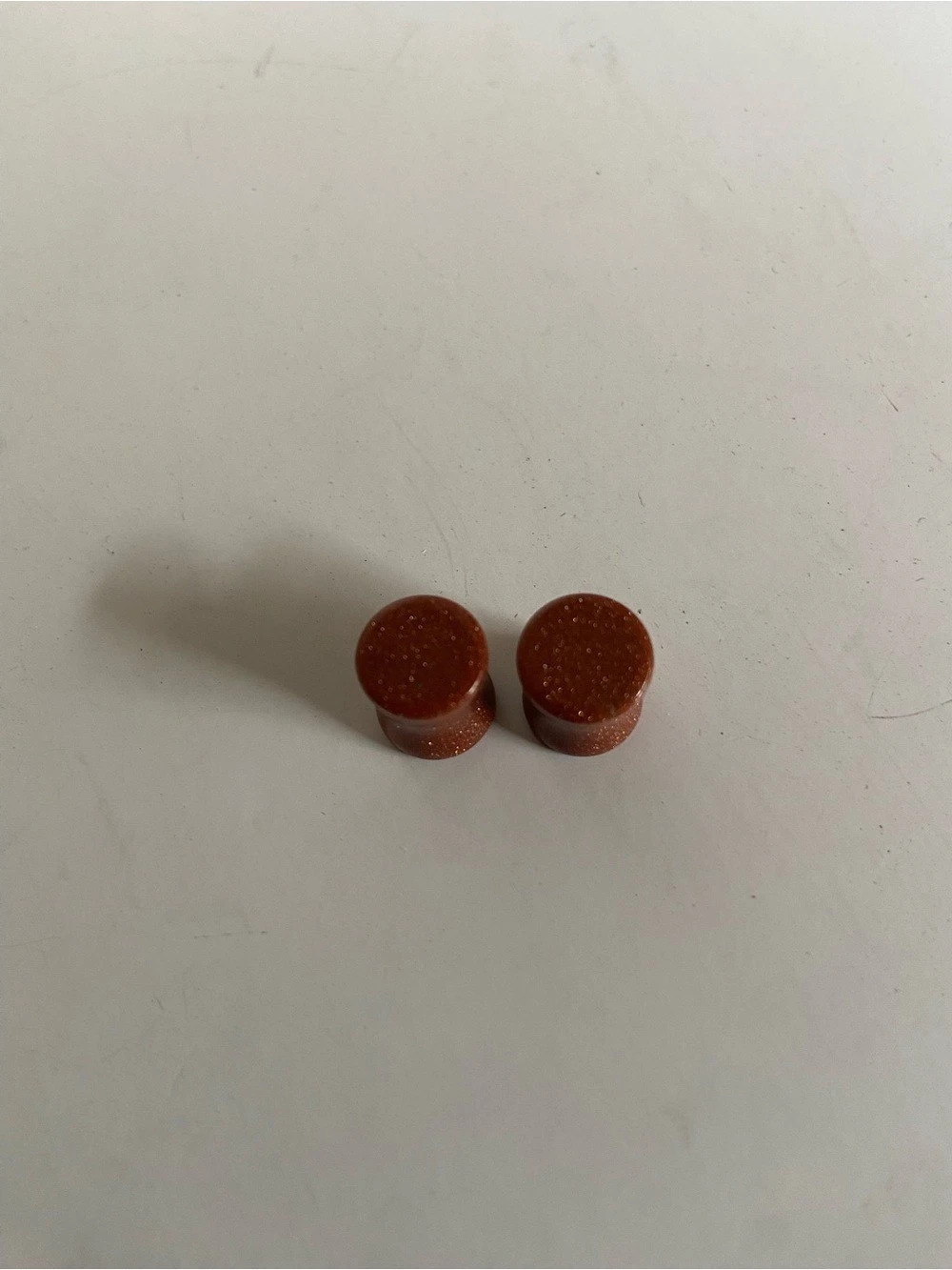 Brown Glittery Flared Plugs